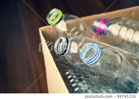 plastic bottles in recycling paper box reuse concept plastic bottles in recycling paper box reuse concept 99745158