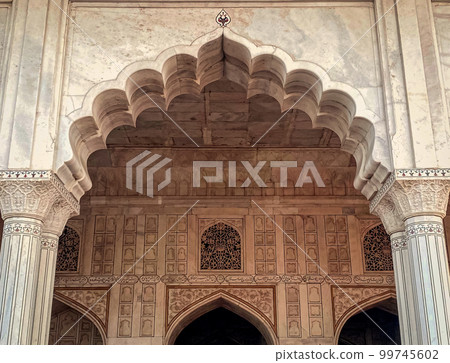 The famous red fort in the city of Agra, India. Tourists visit a popular tourist attraction. The famous red fort in the city of Agra, India. Tourists visit a popular tourist attraction. 99745602