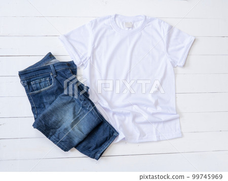 White T Shirt mockup and Jeans on white wood background White T Shirt mockup and Jeans on white wood background 99745969