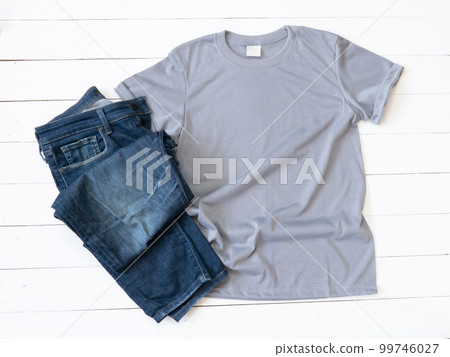 Grey T Shirt mockup and Jeans on white wood background Grey T Shirt mockup and Jeans on white wood background 99746027