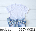 White Tshirt Mockup Athletic Heather plaid shirt Waist Tie And Rolled Sleeve On white Wood 99746032