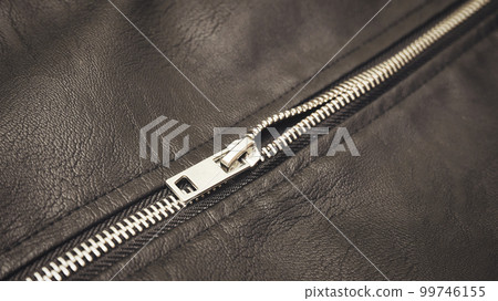 Chrome metal zipper on a leather jacket close-up Chrome metal zipper on a leather jacket close-up 99746155