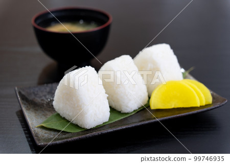 3 salted rice balls, takuan and miso soup 3 salted rice balls, takuan and miso soup 99746935