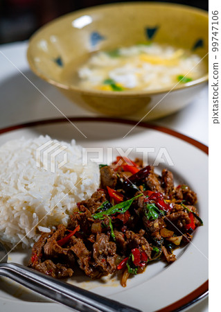 stir-fried basil with pork and fried egg stir-fried basil with pork and fried egg 99747106