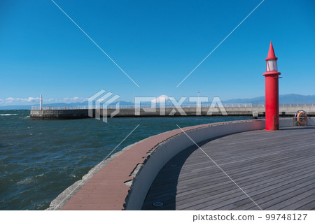 Mt. Fuji seen from the East Promenade of Katase Fishing Port Red Lighthouse and White Lighthouse Mt. Fuji seen from the East Promenade of Katase Fishing Port Red Lighthouse and White Lighthouse 99748127
