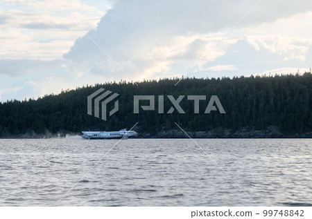 Hydrofoil sailing on a summer lake Hydrofoil sailing on a summer lake 99748842