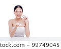 Woman holding Shells polished to pearly surface. The polished shells before being used to make pearl jewelry 99749045
