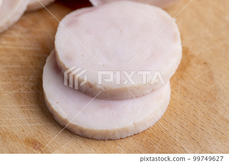Sliced round-shaped ham from chicken meat Sliced round-shaped ham from chicken meat 99749627