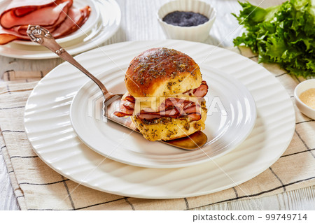Hawaiian Ham and Swiss Slider on white plate 99749714
