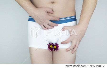 Prostatitis, inflammation of the bladder, cystitis, oncology, male problems, testicular cancer. Man in white shorts with concept symbols. Cutting during urination and pain. Man in white underwear Prostatitis, inflammation of the bladder, cystitis, oncology, male problems, testicular cancer. Man in white shorts with concept symbols. Cutting during urination and pain. Man in white underwear 99749817