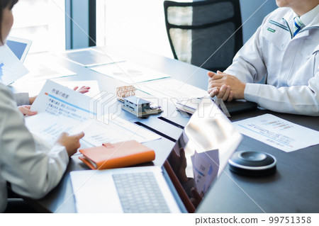 Engineer discussing construction plans faceless Engineer discussing construction plans faceless 99751358