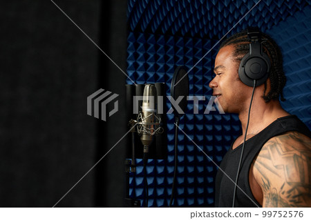 Young african american blogger recording new podcast, blogging, modern methods of personal brand development, boging as a business, modern artists 99752576