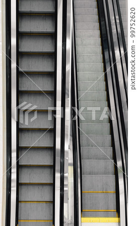 Top view of long escalator stairs. 99752620