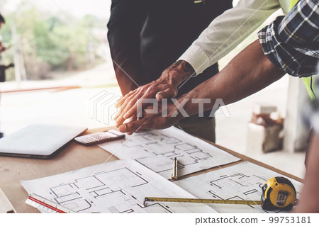 Foreman or Civil engineer put their hand to working together. industry professional team and engineer concept Foreman or Civil engineer put their hand to working together. industry professional team and engineer concept 99753181