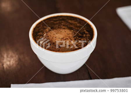 Barista preparing to test and inspecting the quality of coffee 99753801