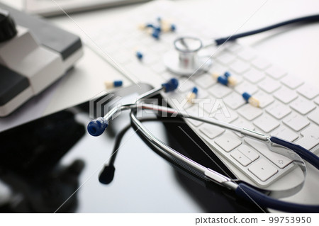 Medical pills or vitamins with keyboard and stethoscope Medical pills or vitamins with keyboard and stethoscope 99753950