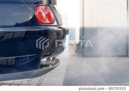 smoke from the exhaust of a car with a gasoline engine smoke from the exhaust of a car with a gasoline engine 99755555