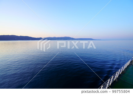 Akashi Strait and Awaji Island at dawn seen from the ferry Akashi Strait and Awaji Island at dawn seen from the ferry 99755804
