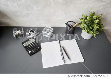 Office desk table with supplies, paper, calculator. Top view with copy space. Selective focus. Business Financing Accounting Banking Concept 99755885