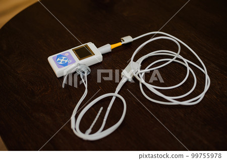 Man using pulse oximeter measures oxygen saturation level, health care monitoring concept. Pulse oximeter on brown background Man using pulse oximeter measures oxygen saturation level, health care monitoring concept. Pulse oximeter on brown background 99755978