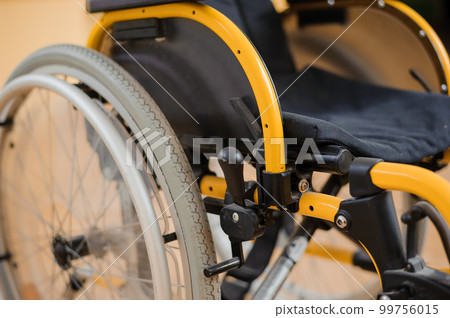 Children's wheelchair. Empty wheelchair in the hospital. Wheelchair close up 99756015