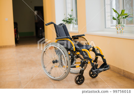 Children's wheelchair. Empty wheelchair in the hospital. Wheelchair close up 99756018