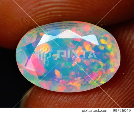 Natural precious stone noble opal on a black background Natural precious stone noble opal on a black background 99756049