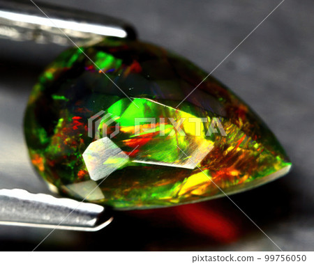 Natural precious stone noble opal on a black background Natural precious stone noble opal on a black background 99756050