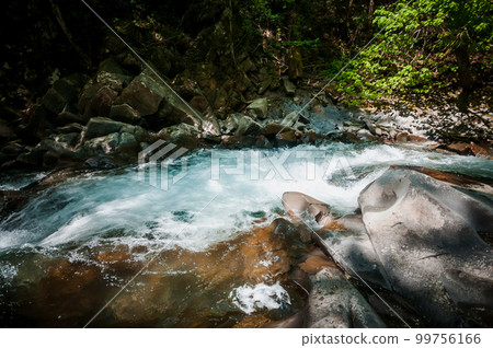 Blue Lagoon, mountain river among the rocks in the forest 99756166