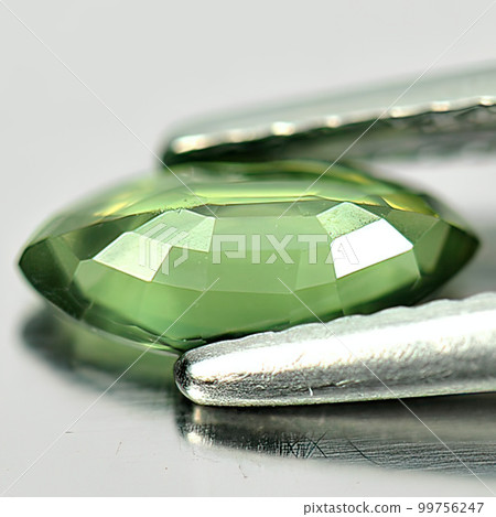 Natural gemstone green tourmaline on white background 99756247