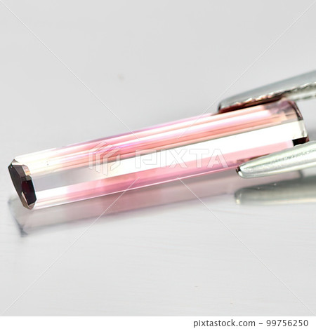 Natural gemstone pink tourmaline indicolite on white background 99756250