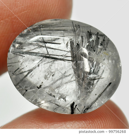 Natural gemstone rutile quartz isolated on white background Natural gemstone rutile quartz isolated on white background 99756268