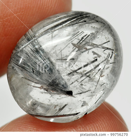 Natural gemstone rutile quartz isolated on white background Natural gemstone rutile quartz isolated on white background 99756270