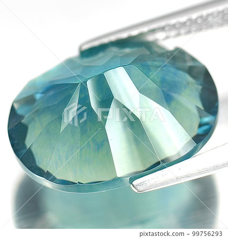 Natural gemstone blue fluorite on gray background 99756293