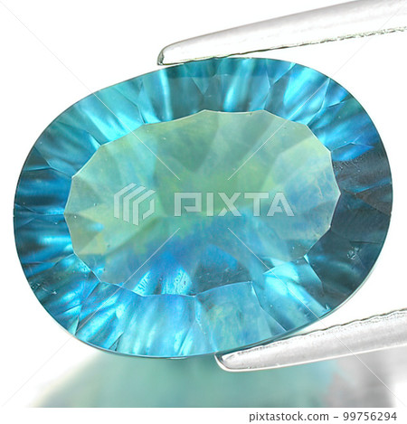 Natural gemstone blue fluorite on gray background 99756294