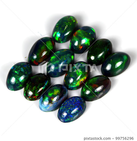 Natural gemstone rainbow opal on gray background Natural gemstone rainbow opal on gray background 99756296