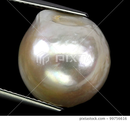 Natural pearls on a black background Natural pearls on a black background 99756616