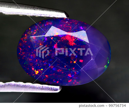 Natural beautiful gemstone opal on gray background 99756734