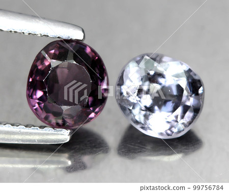 Natural beautiful spinel gemstones on gray background Natural beautiful spinel gemstones on gray background 99756784