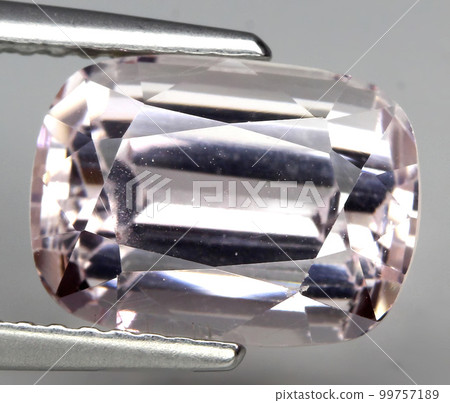Natural beautiful gemstone kunzite on gray background 99757189