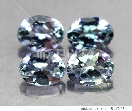 Beautiful natural tanzanite gemstone on gray background 99757201
