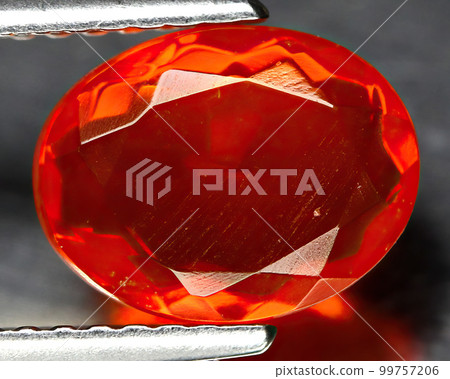 Natural beautiful gemstone opal on gray background 99757206