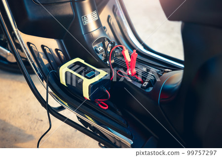 Charging battery in motorcycle for start. 99757297