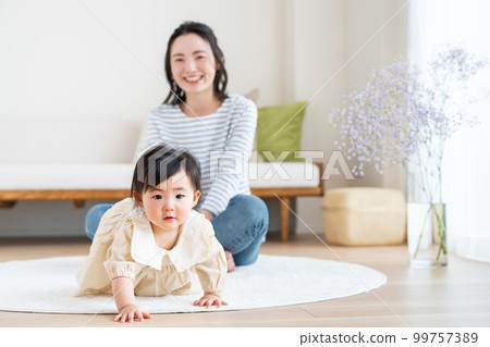 Young mother with baby in living room Young mother with baby in living room 99757389