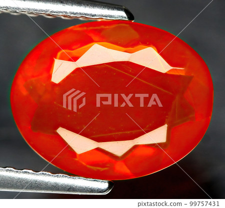 Natural beautiful gemstone opal on gray background 99757431