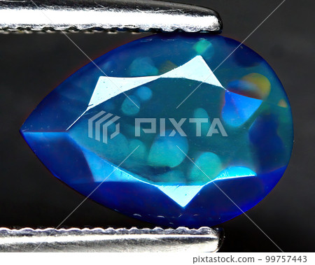 Natural beautiful gemstone opal on gray background 99757443