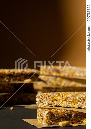Homemade Granola energy bar. Variety of homemade protein granola breakfast bars, with nuts, raisins dried cherries and chocolate. Healthy nutrition eating Gluten free cereal dieting snack super food 99758321