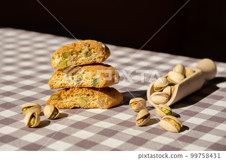 Biscotti Cantuccini Cookie Biscuits with pistachios and lemon peel Shortbread. Healthy eating food. Homemade fresh Italian cookies cantucci stacks and organic pistachios nuts. Vegan dieting 99758431