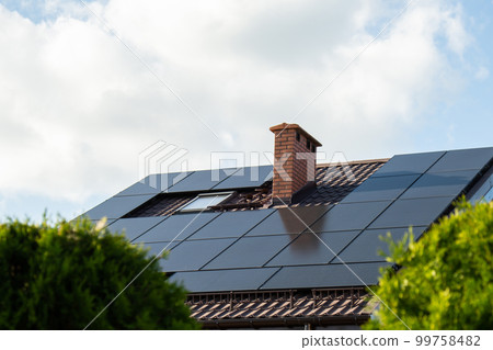 New ecologic house with solar panels Alternative to conventional energy. The battery is charged from a solar cell Advertisement Green energy Sustainable life Renewable  99758482