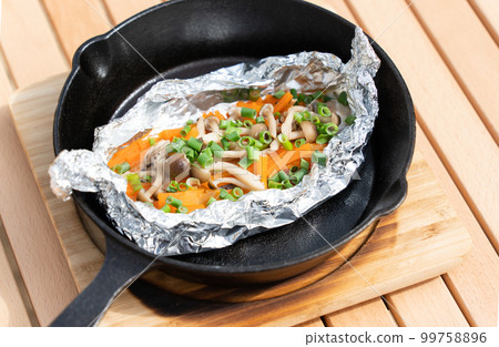 Camping rice with foil grilled salmon made in a skillet 99758896